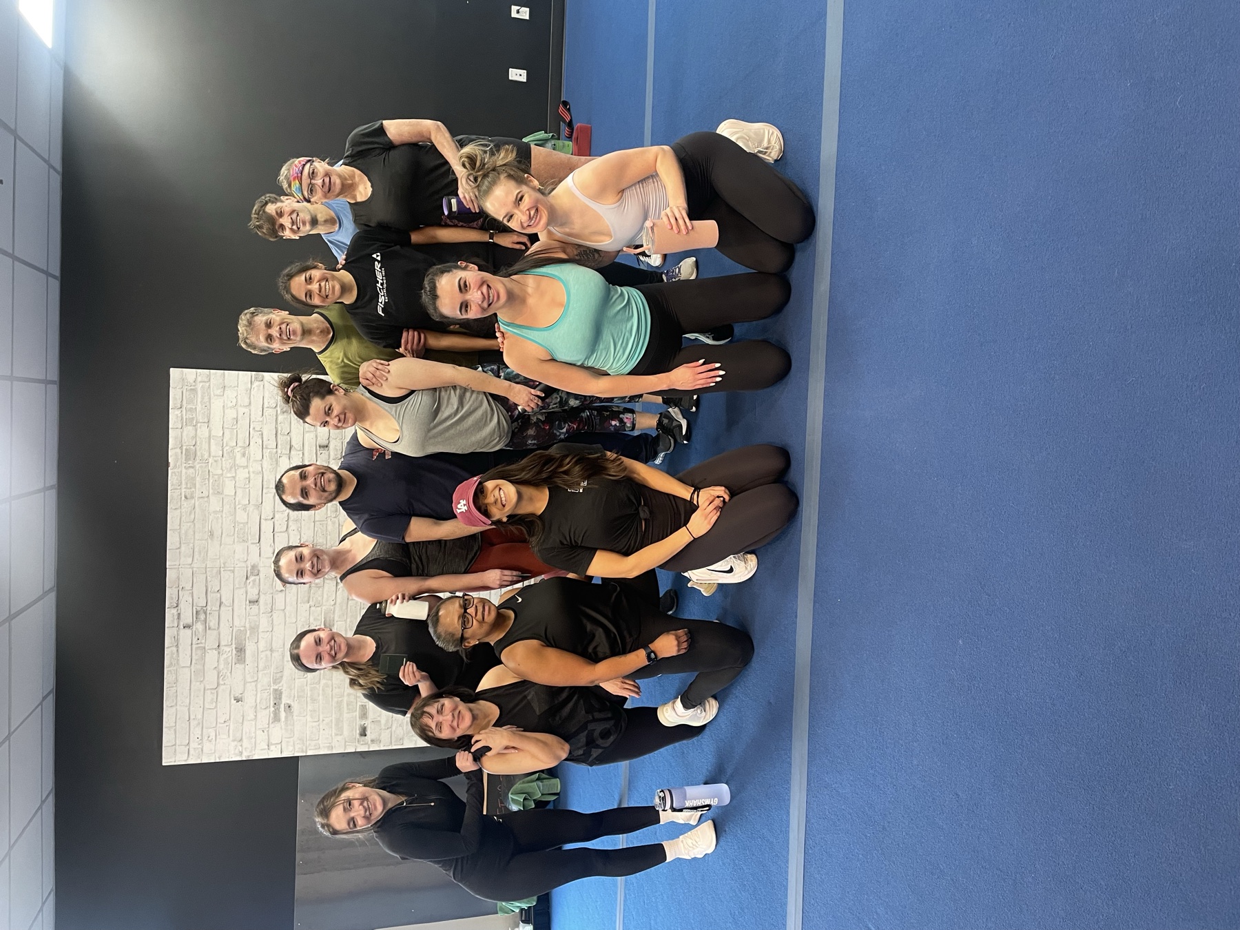 A full Fit Training class posing together after a session